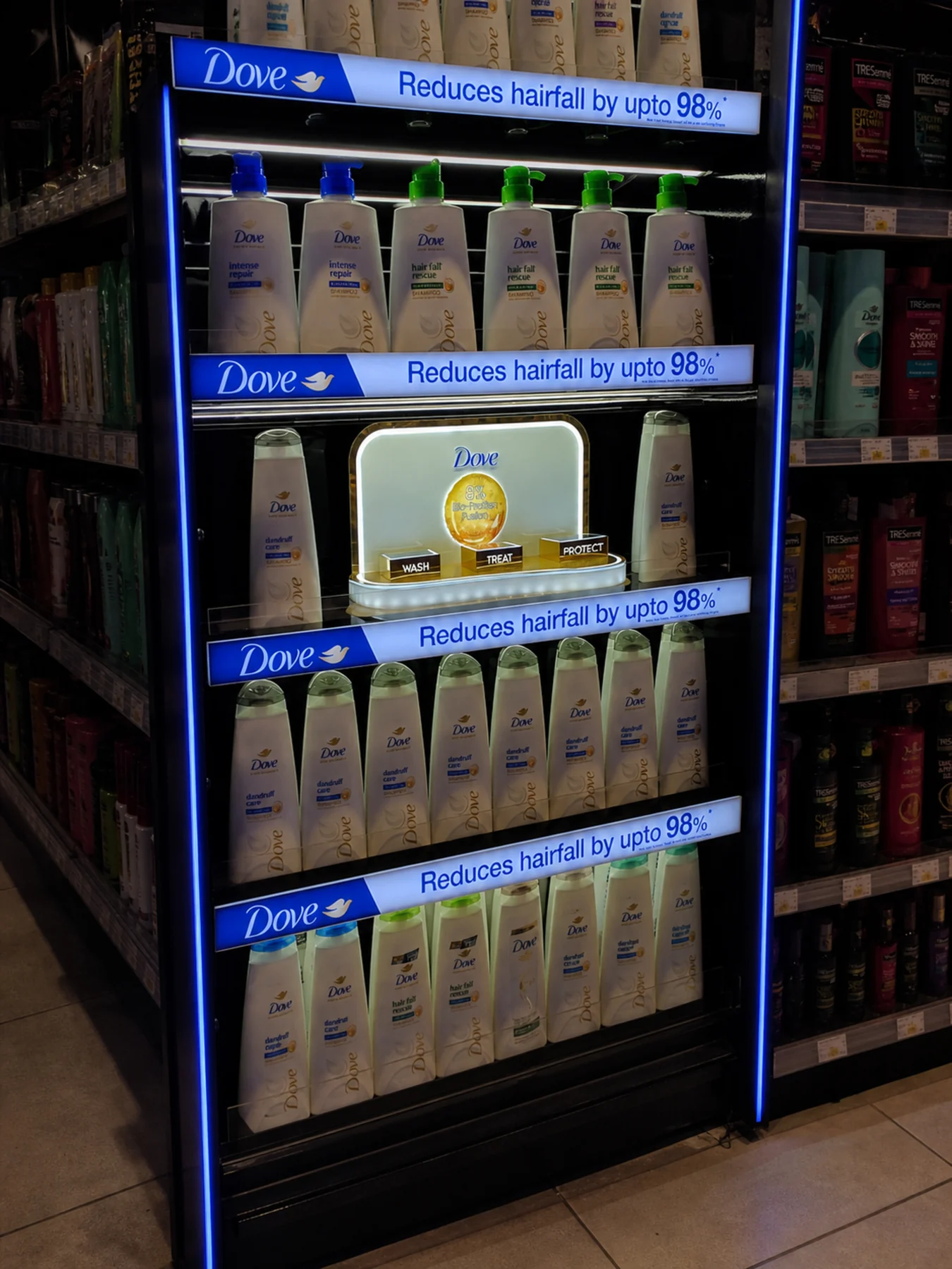 Illuminated Dove hairfall bay with the claim repeated on every shelf front
