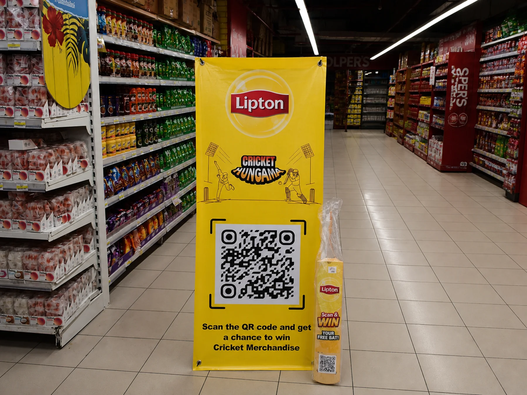 Lipton PSL standee standing beside a competitor tea fixture