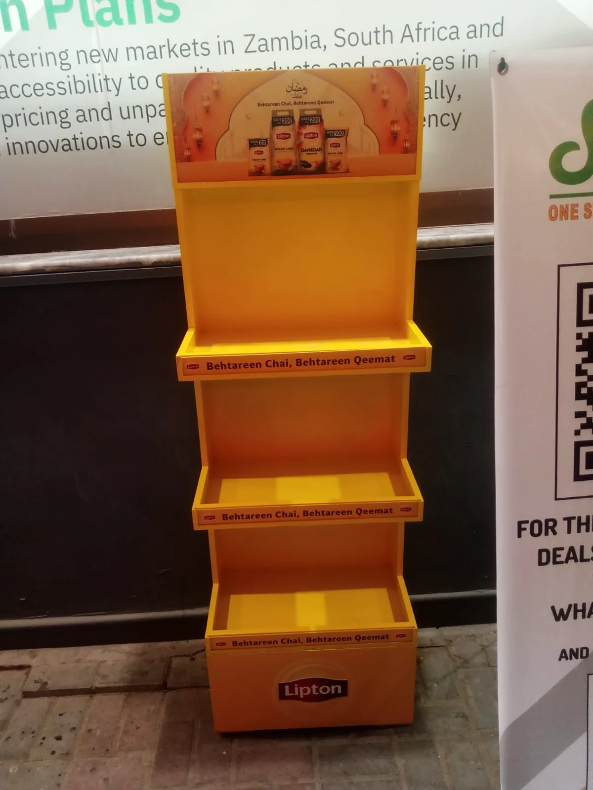 Lipton Ramzan unit at a shopfront under evening light