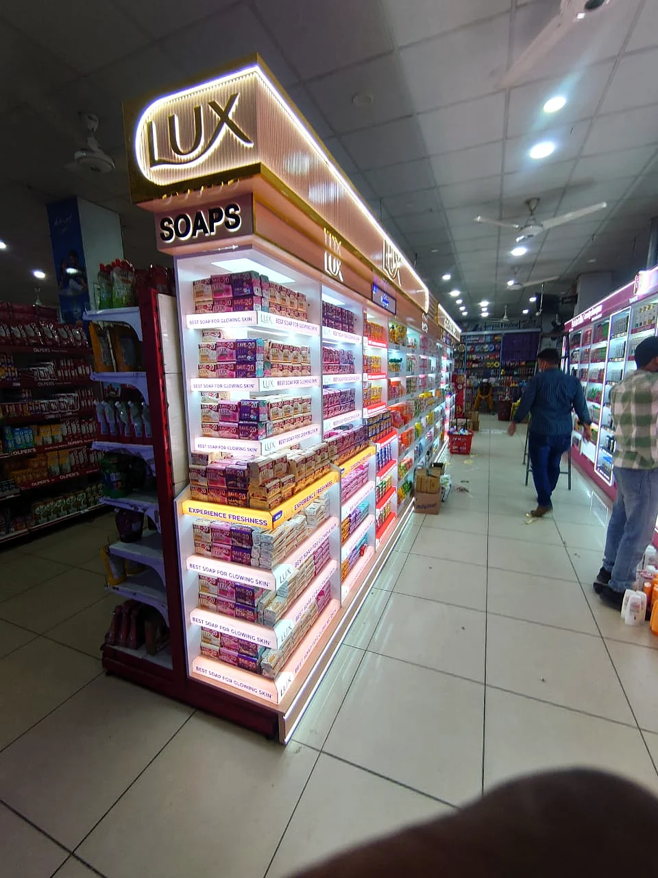 Illuminated Lux Soaps category run down a supermarket aisle
