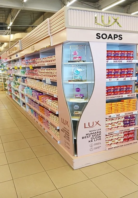 Lux Soaps illuminated end unit at the head of an aisle